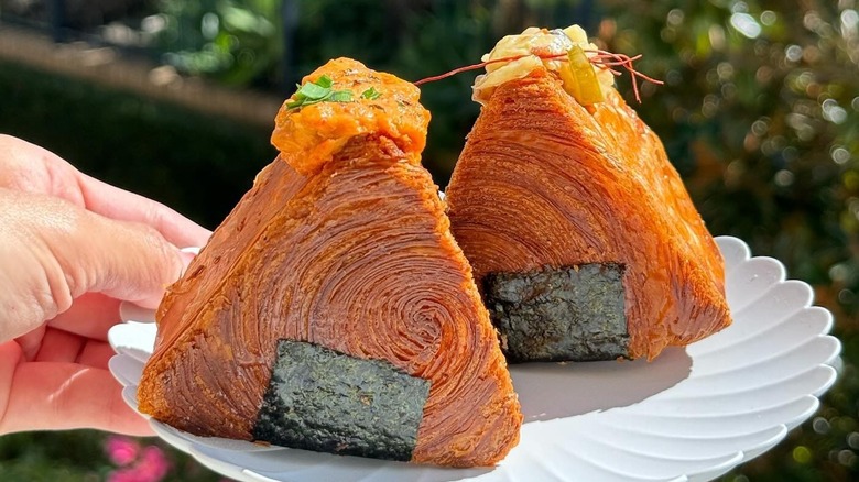 triangle-shaped croissants wrapped in seaweed to mimic Japanese onigiri