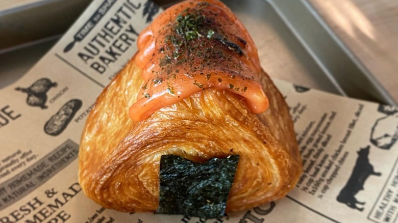 triangle-shaped croissants wrapped in seaweed to mimic Japanese onigiri