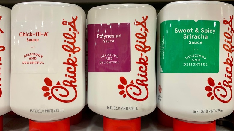 Three flavors of Chick-fil-A sauce on grocery store shelf