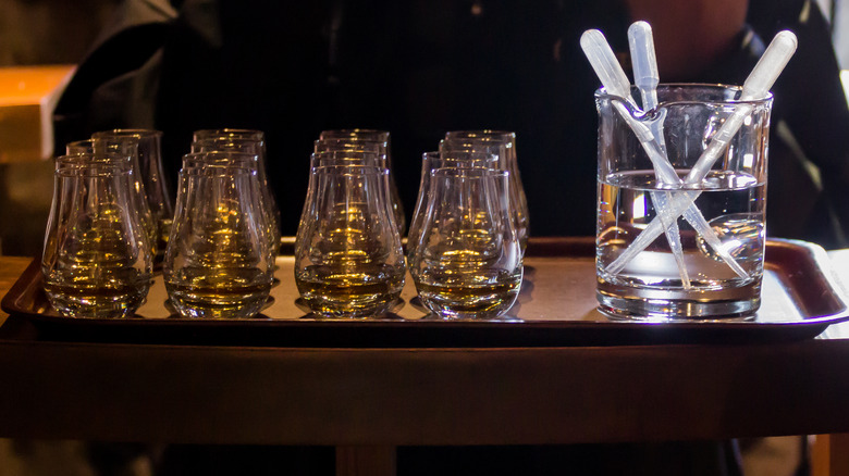 Bourbon samples with water droppers