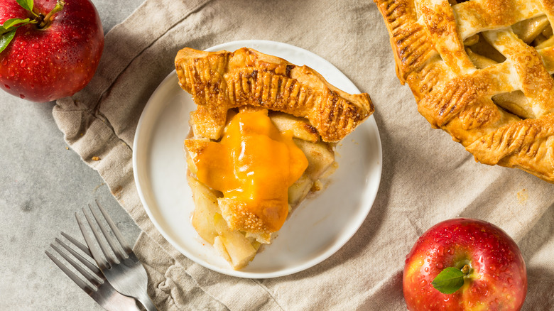 slice of apple pie with cheddar cheese on top