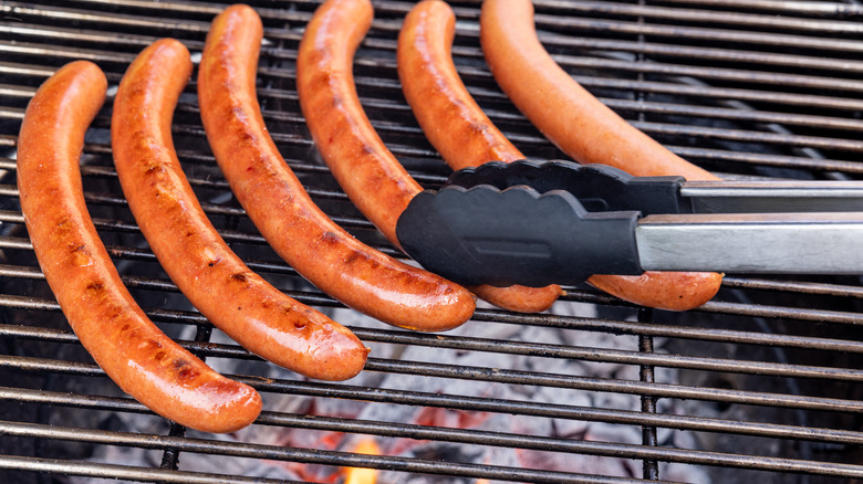 Boiled hot dogs on a grill
