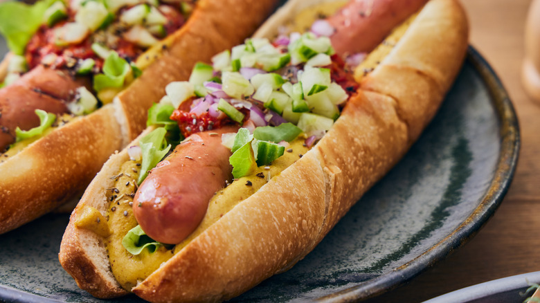 Juicy hot dogs with colorful condiments