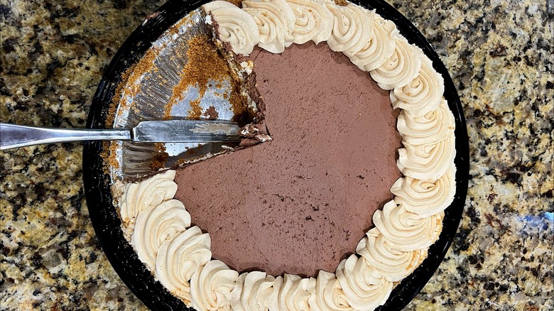 Costco Peanut Butter Chocolate Cream Pie with a piece missing