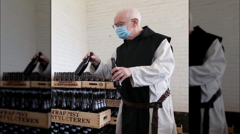 A monk from Sint-Sixtus Abbey with crates of Westvleteren beers