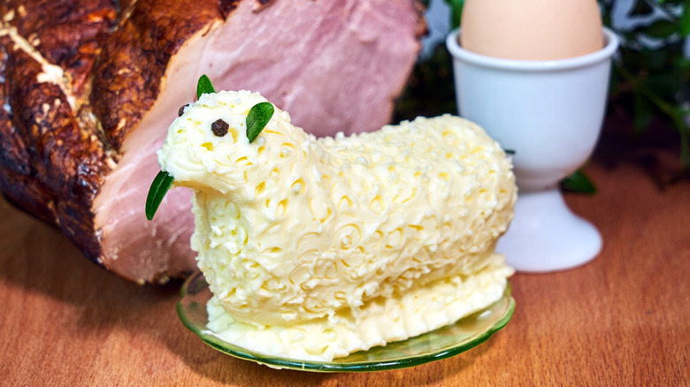 Butter lamb with ham in background