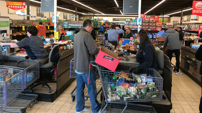 Customers in Aldi checkout lanes