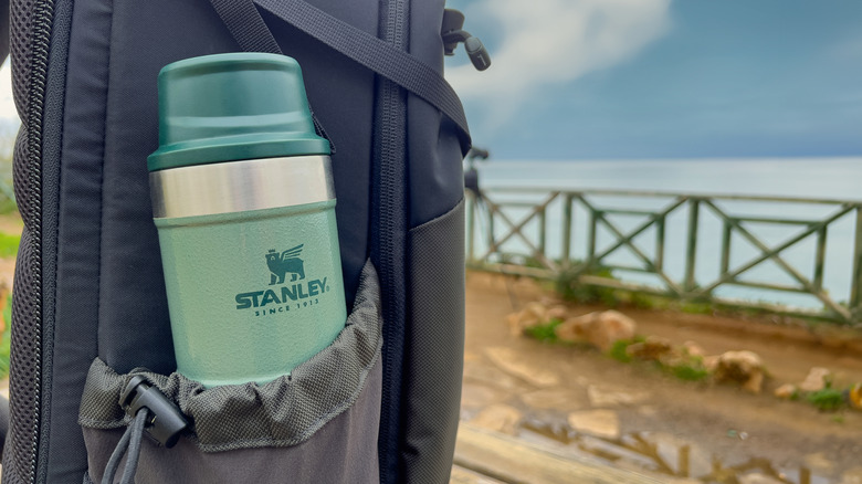 Stanley Trigger Action mug in black backpack.