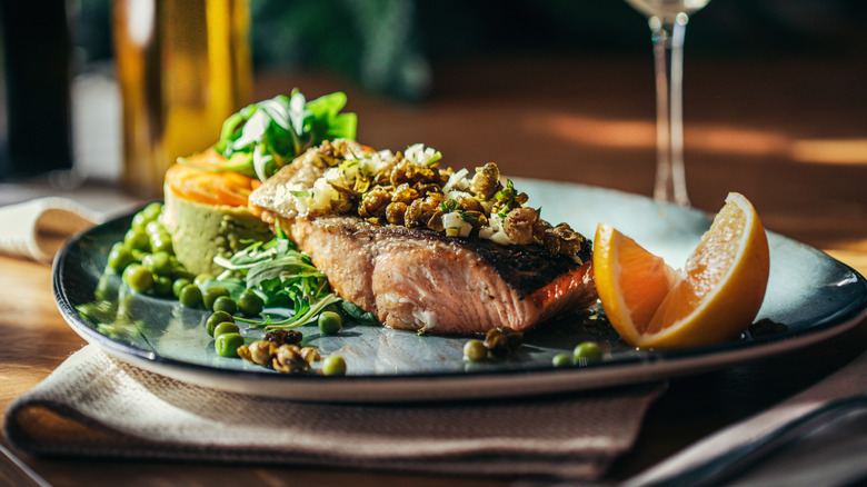 Salmon with salad and white wine