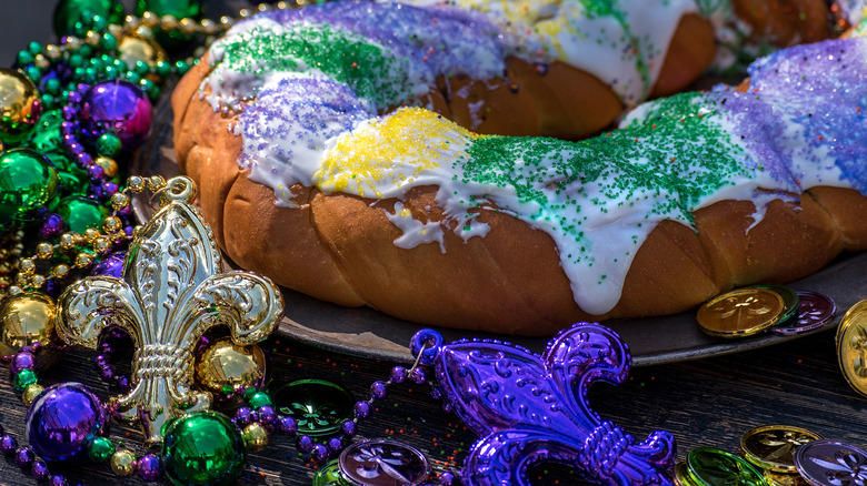 Mardi Gras King Cake with purple, green, and gold decoration