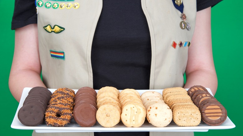 Girl Scout holding tray of cookies