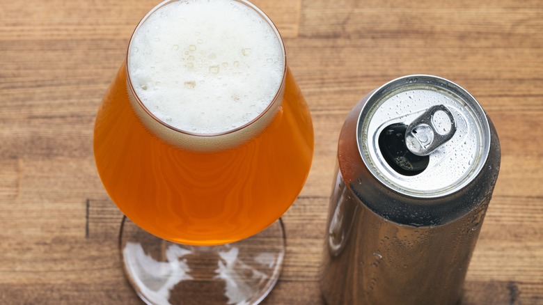 Craft beer in a snifter with can