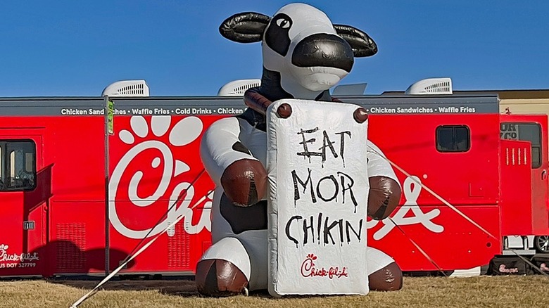 Chick-fil-A cow inflatable with sign