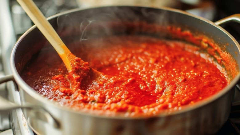 Red sauce cooking in a pan