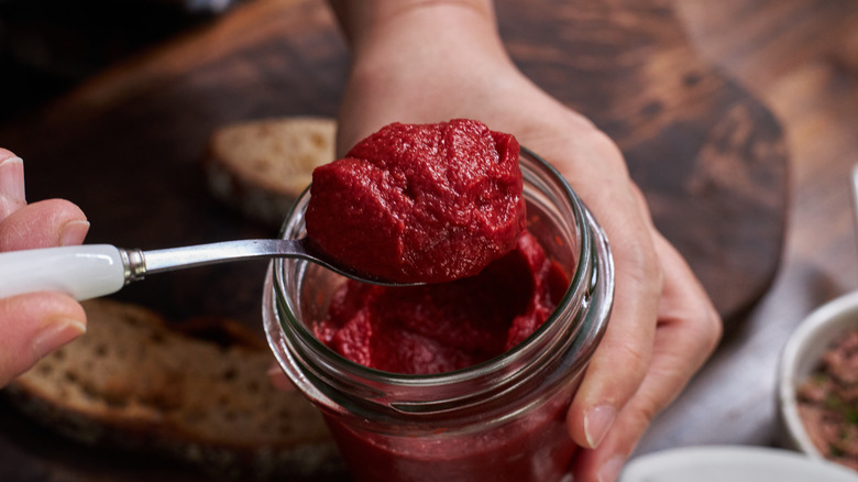 Tomato paste being spooned out