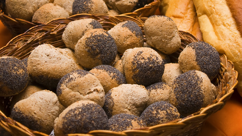 Bread dusted with poppy seeds in basket