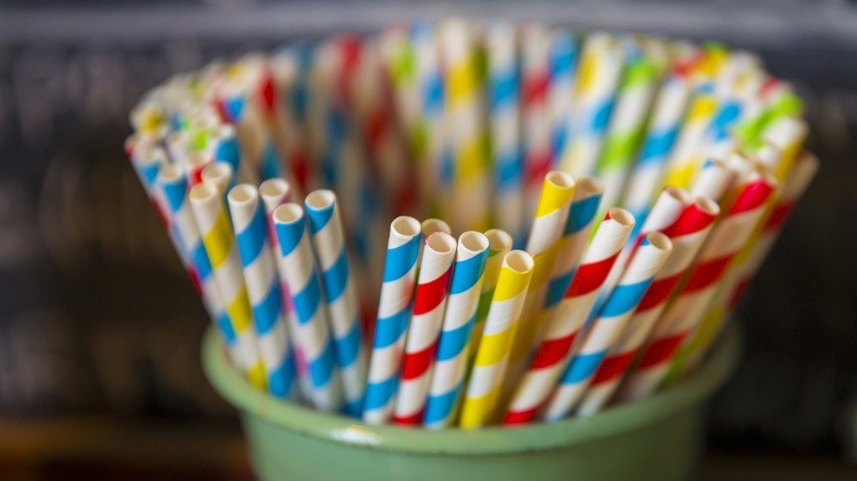 Paper straws in a green cup