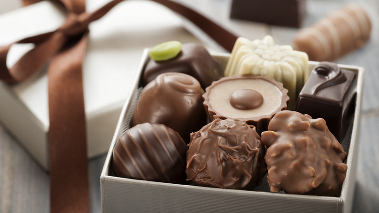 Box of assorted candies with brown ribbon