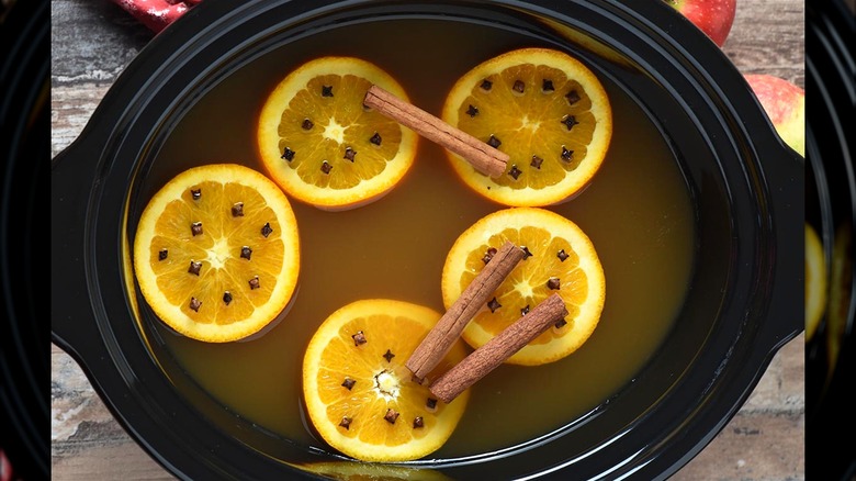 Mulled cider with oranges in crock pot