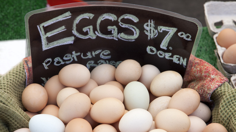 farm-fresh eggs in a basket at a farmer's market