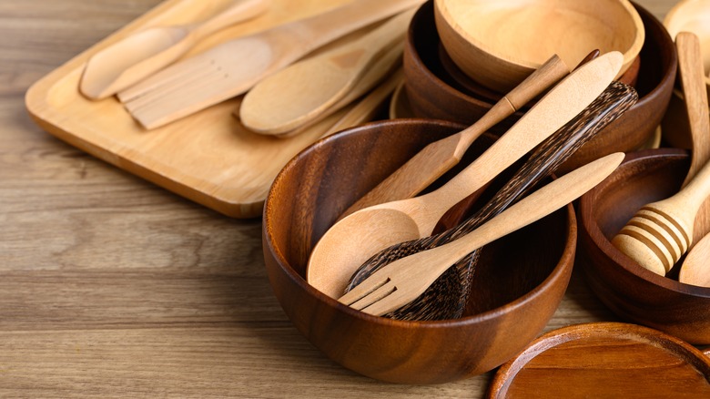 Wooden kitchen utensils in wood bowl