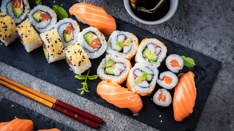 Top view of assorted sushi rolls with a variety of ingredients.