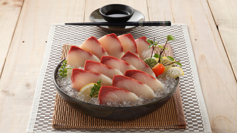 Hamachi (yellowtail) sashimi on a plate.