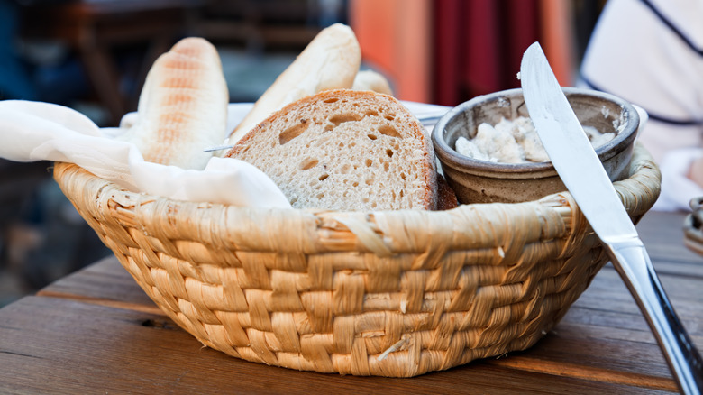 Horizontal image of the basket with bread and butter