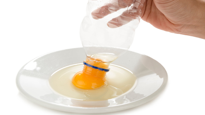 Bottle sucking up egg yolk