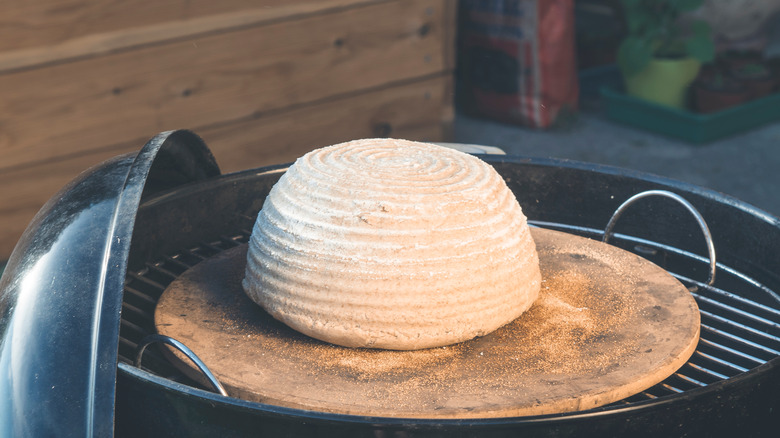 baking bread boule on stone in grill