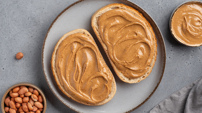 Peanut butter spread on slices of bread