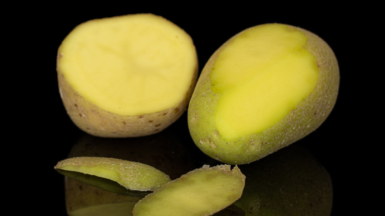 potatoes with slices removed revealing green interior