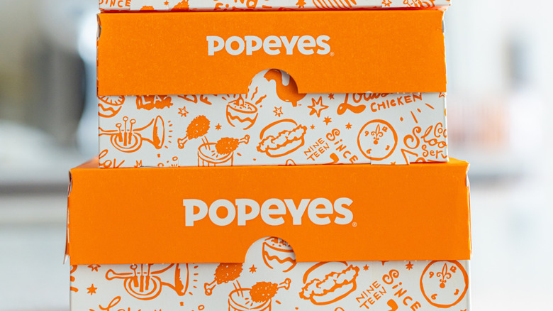 Closeup Popeyes branded paper boxes