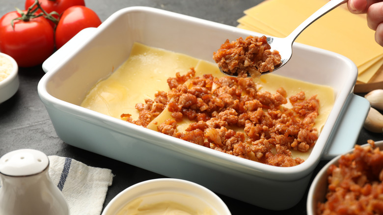 Person making lasagna.